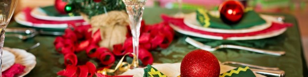 An image of two champagne glasses toasting in a clean kitchen at Christmas.