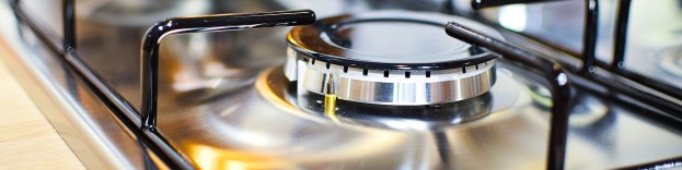 An image of a silver cooker hob shining because it has been cleaned.