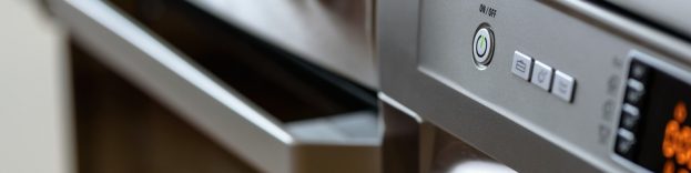 An image of a silver cooker which has been fitted in a modern kitchen.