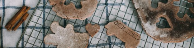 An image of slightly burnt cookies on a cooling rack